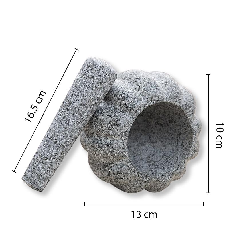 Mortier et pilon en roche de granit sculptée taille